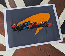 Cargar imagen en el visor de la galería, Lando Norris 2023 F1 Car print - Fueled.art
